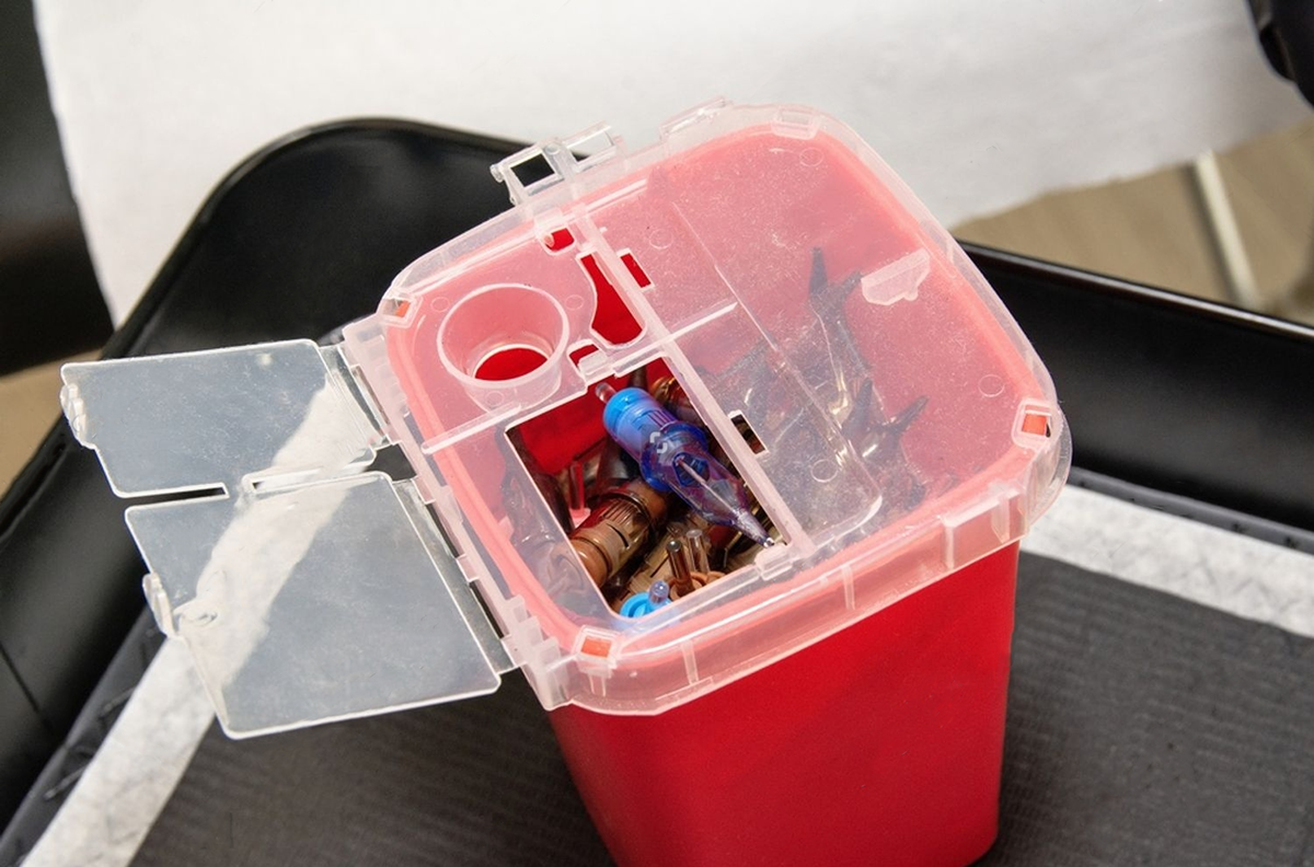 overfilled sharps container